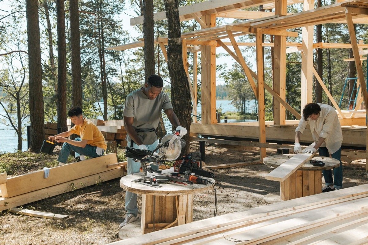 Timberquill Build Co. crew cutting and framing lumber on site